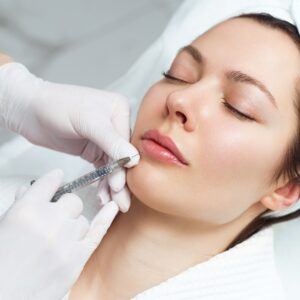 woman having injectable treatment on her chin